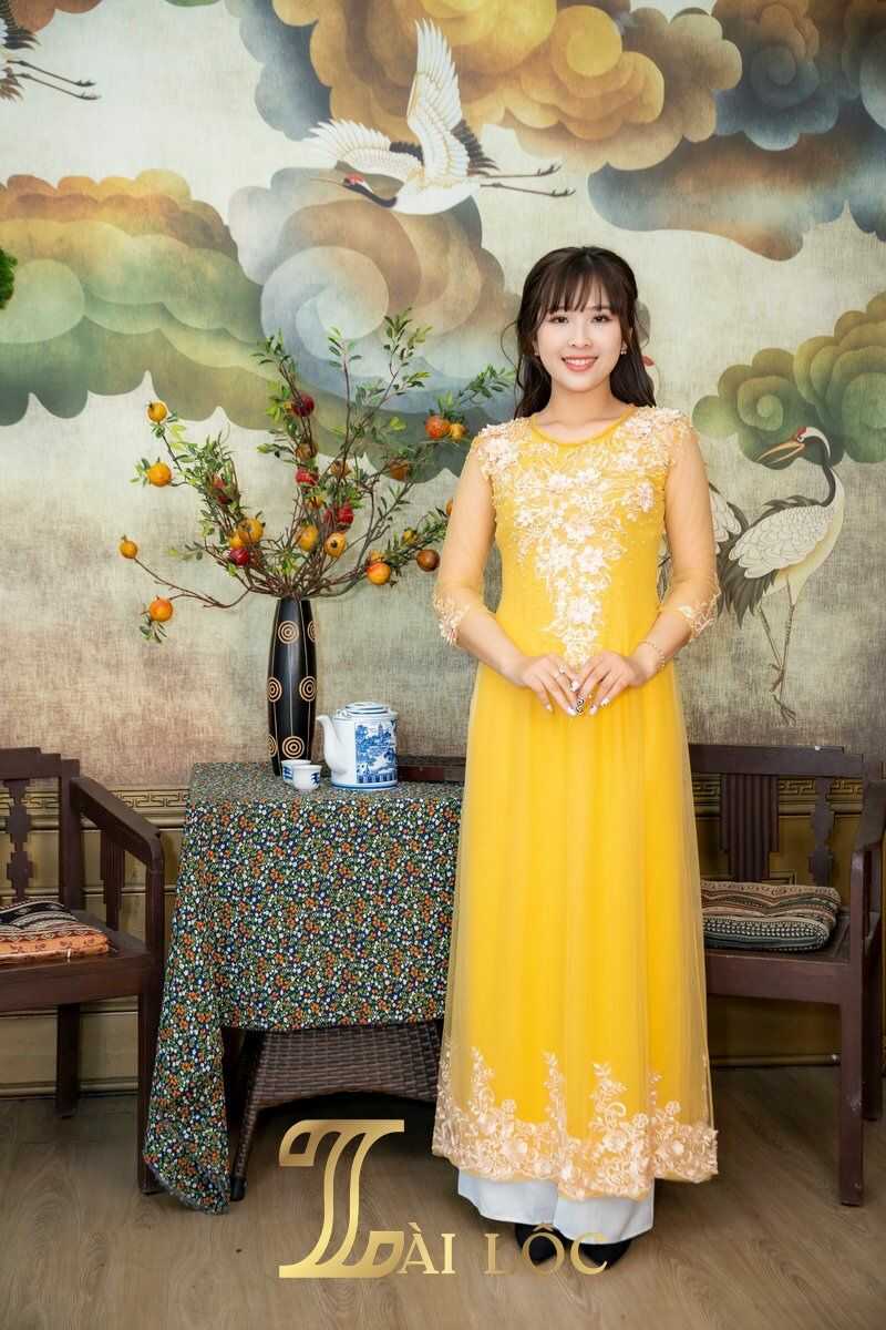 Áo dài bà sui màu vàng đồng sang trọng